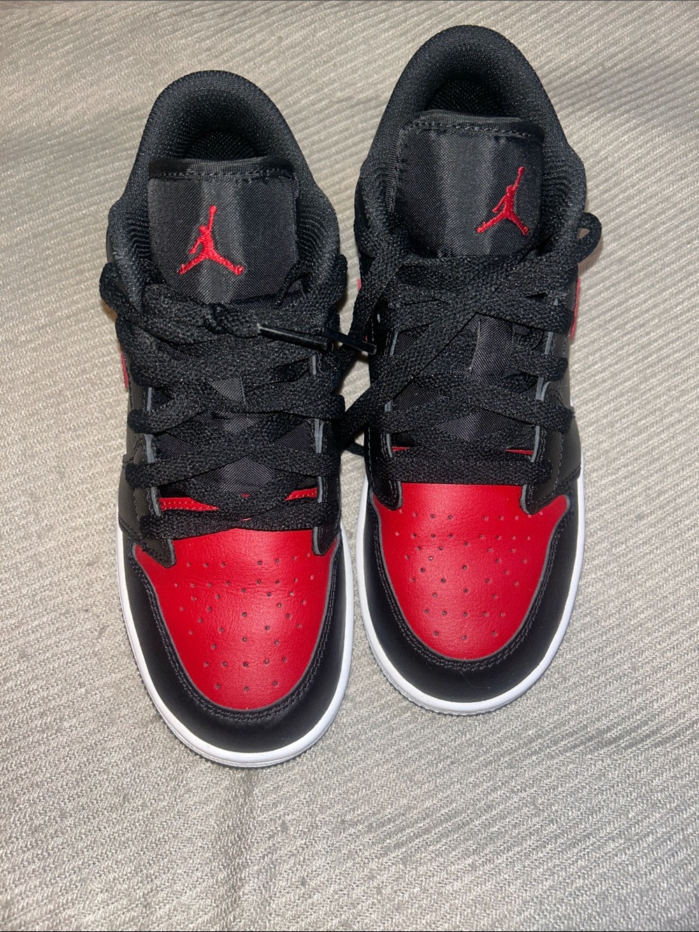 Nike Jordan 1’s lows Kids' Black & Red Low-Top Sneakers